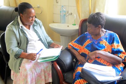 Dr Florence Tuguminssiriza attends to pensioner who formally worked at the faccility as a Nursing Officer